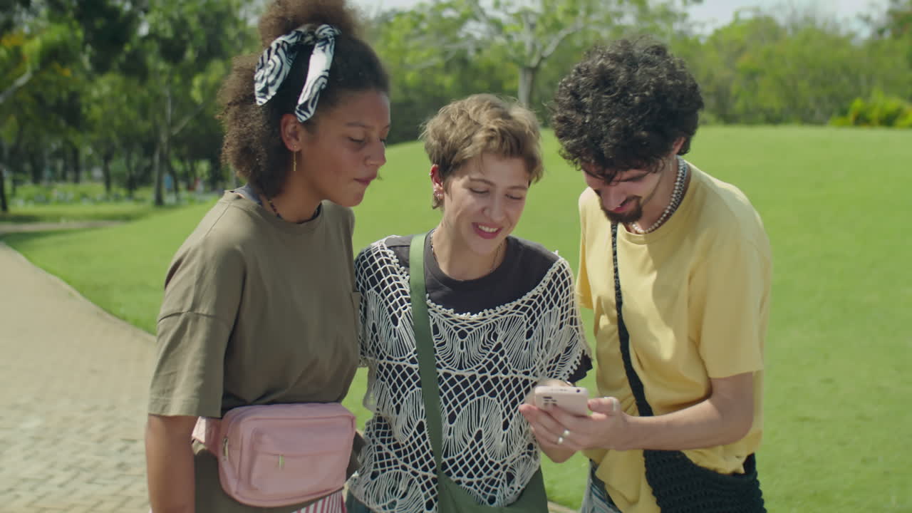Cheerful Friends Taking Selfie in Park