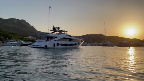 scenic view of luxury yacht at harbor in porto cervo at sunset, italy