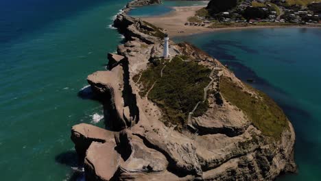 fly over castlepoint lighthouse on limestone reef, walkaway with platforms and limestone reef on seaside