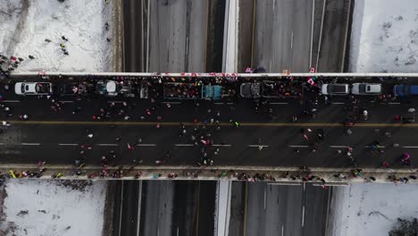 people gather on bridge for the freedom convoy 2022