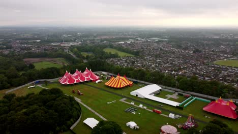 slow aerial flyover with pan down focusing on the colourful marquee