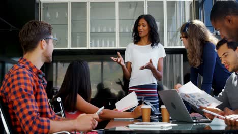 Executives-discussing-during-meeting