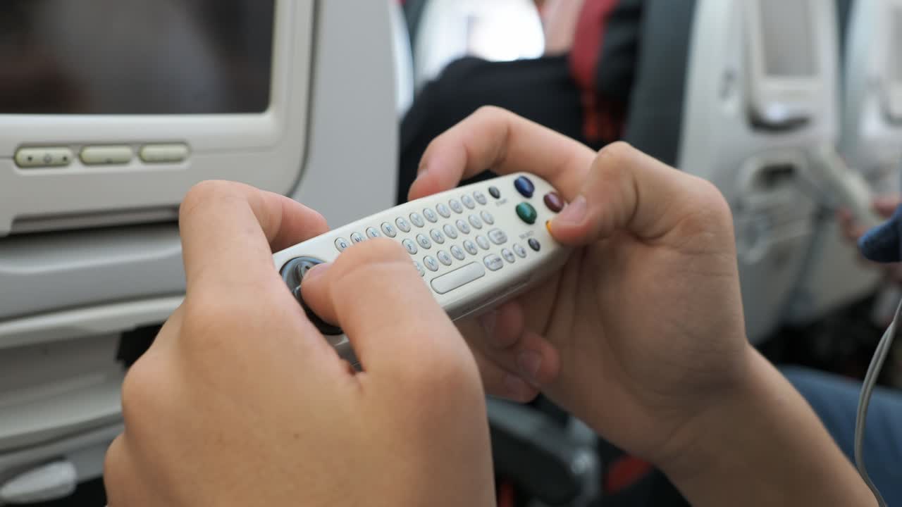 Using airplane entertainment system remote control