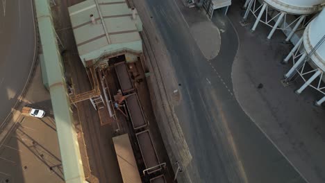 long cargo train wagons loaded with iron in esperance port area, western australia