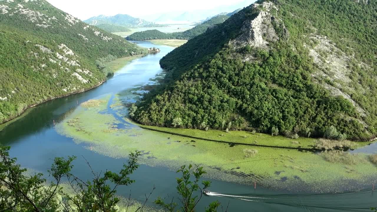 curvy stretch of river Rijeka Crnojevica, in Montenegro, Europe. Panoramic aerial view