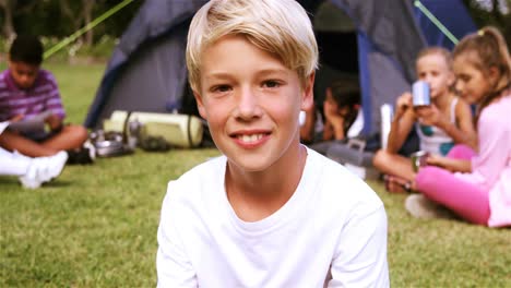 portrait of smiling boy in park