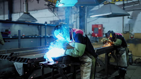 welding workers in a factory