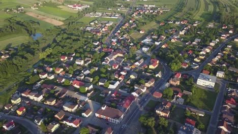 Aerial-shot-with-tilt-down-of-a-little-town-in-the-countryside-of-Poland