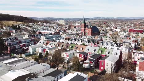 aerial of typical pennsylvania town with rowhouses and large church or cathedral distant reading pa