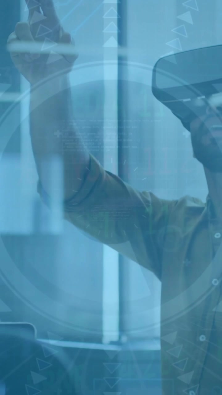 Animation of financial data processing over businessman in vt headset in office