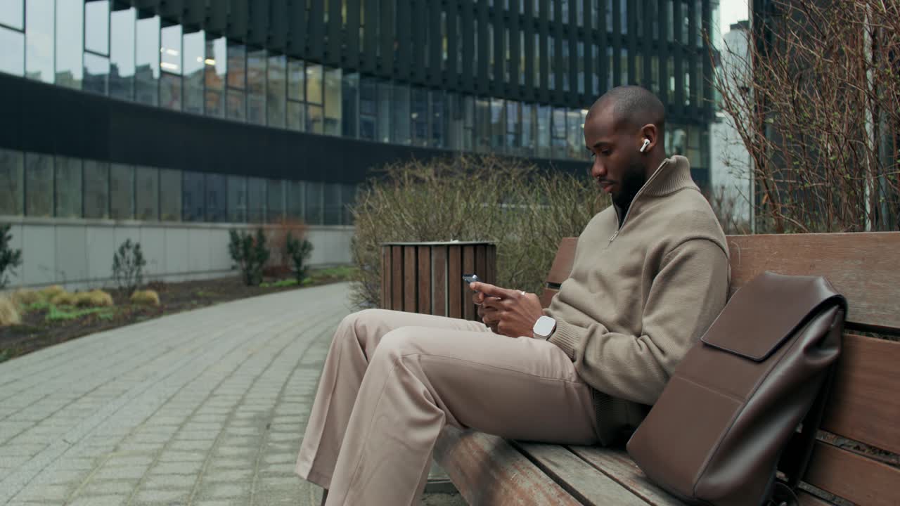 Man using smartphone outdoors