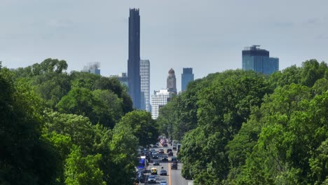 long aerial zoom shot between thick foliage of trees in prospect park