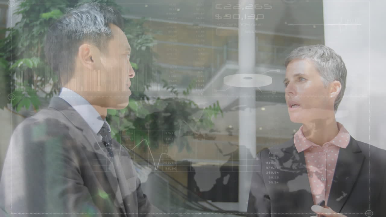 Discussing financial data, business professionals in office with animation in background