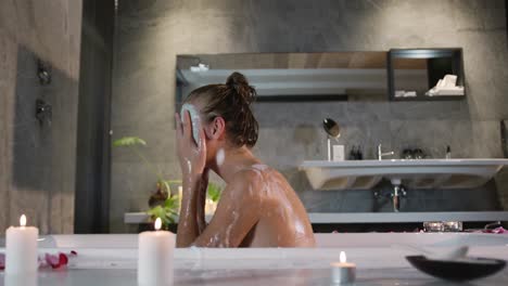 Caucasian-woman-taking-bath-in-hotel