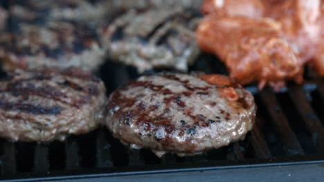 BBQ-Beef-Burger-and-Chicken-Wings-Being-Cooked-on-Grill