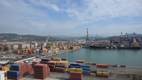 time lapse of containers and freight ship crane mooring and trucks in freight terminal port.