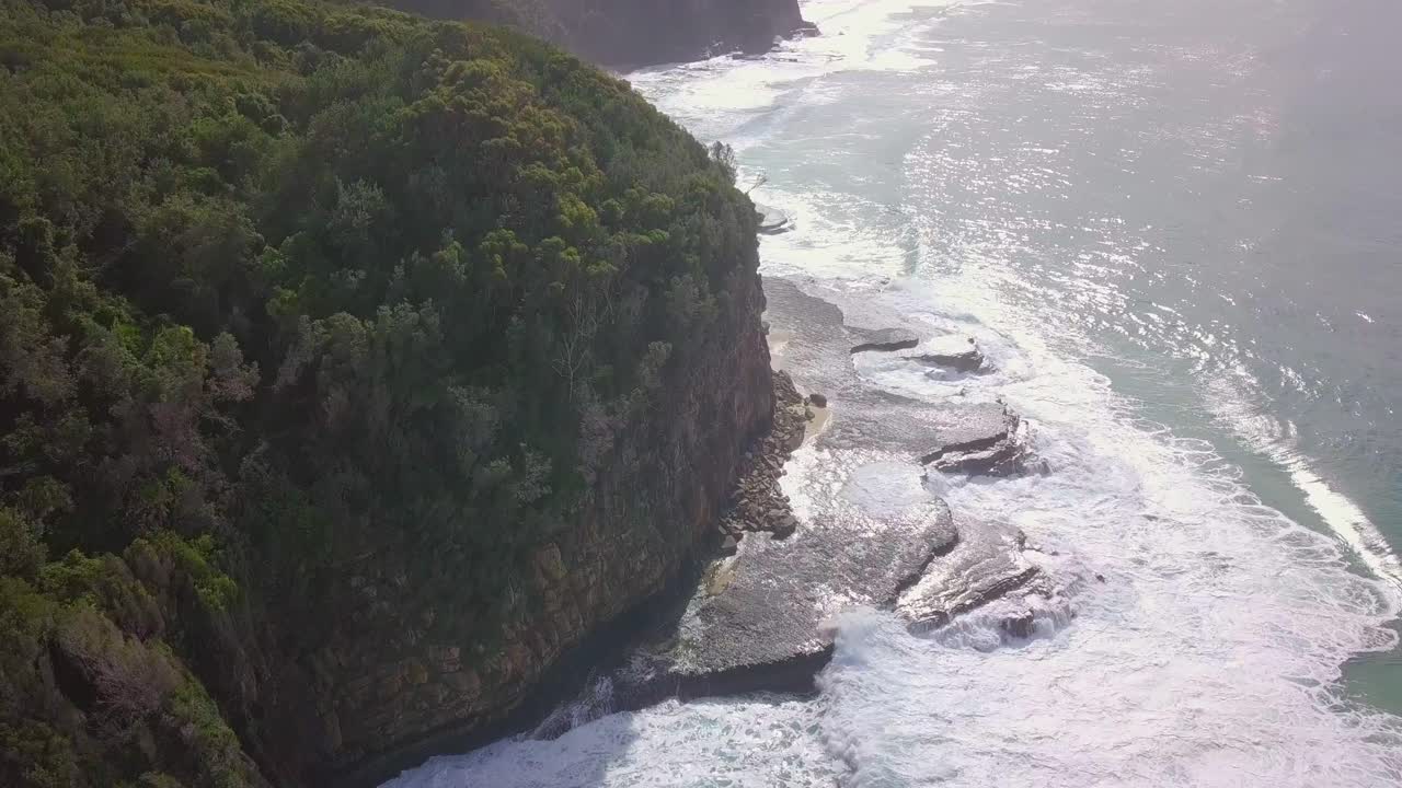 Spectacular aerial morning flight over high cliffs and wide horizon, Australia