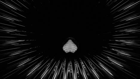 vj loop - 3d heart rolling along a glowing, circular black and white tunnel