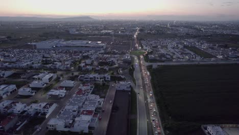 A-long-line-of-cars-at-the-exit-of-a-neighborhood