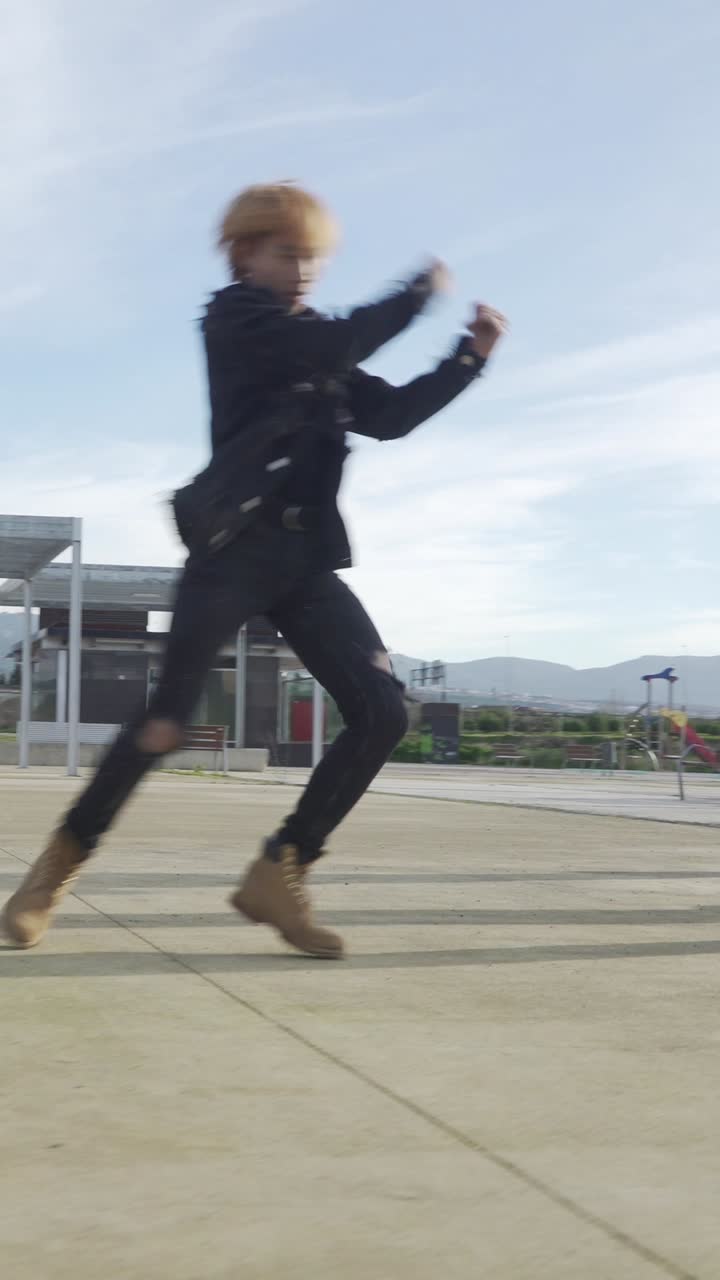 Young STREET PERFORMER performing on the street. Seven chinese teenagers dancing kpop