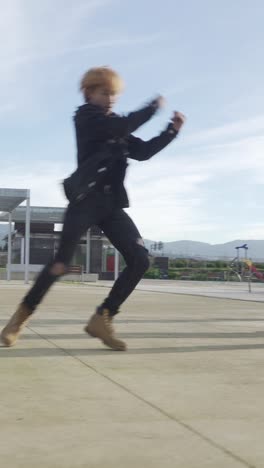 young street performer performing on the street. seven chinese teenagers dancing kpop
