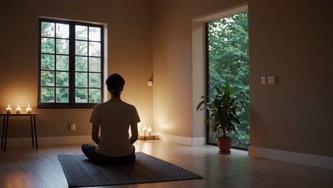 woman meditating in a peaceful room
