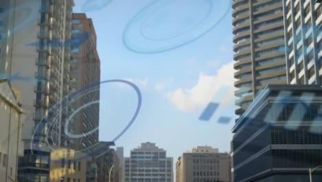 Animation-of-graphs-and-circles-over-multiple-modern-buildings-against-cloudy-sky