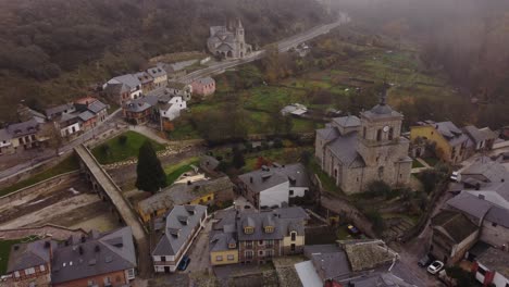 aerial view of a picturesque village with two charming churches