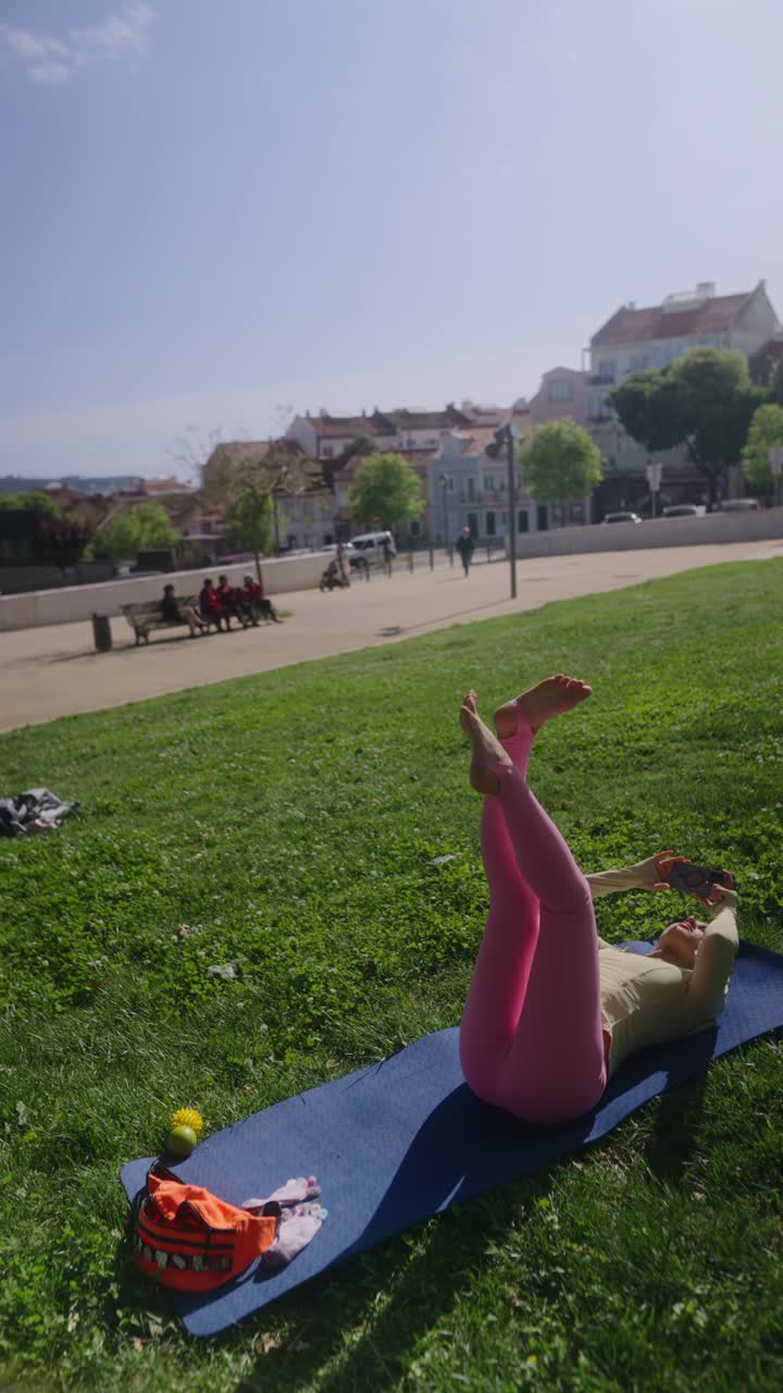 Woman doing yoga in a city park