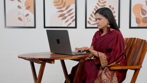 confused indian woman using laptop