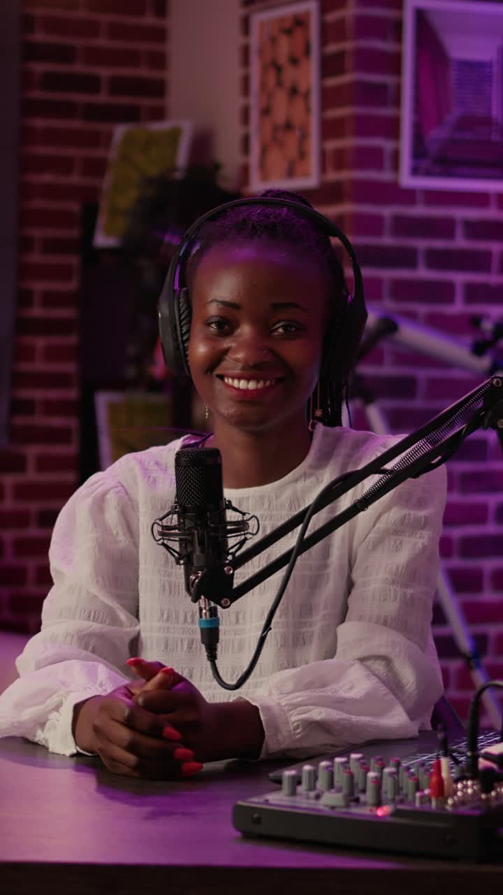 Woman recording a podcast in a studio