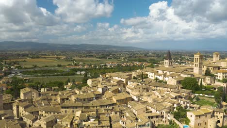 drone flies above spello, italy on classic summer day