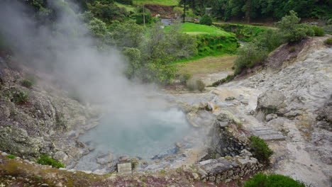 Aerial-drone-shot-of-natural-geothermal-volcanic-caldera-in-Furnas,-Sao-Miguel-island,-Azores,-Portugal