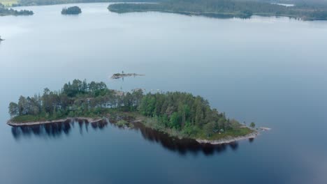 tranquil view of a small island amidst still water of a sea