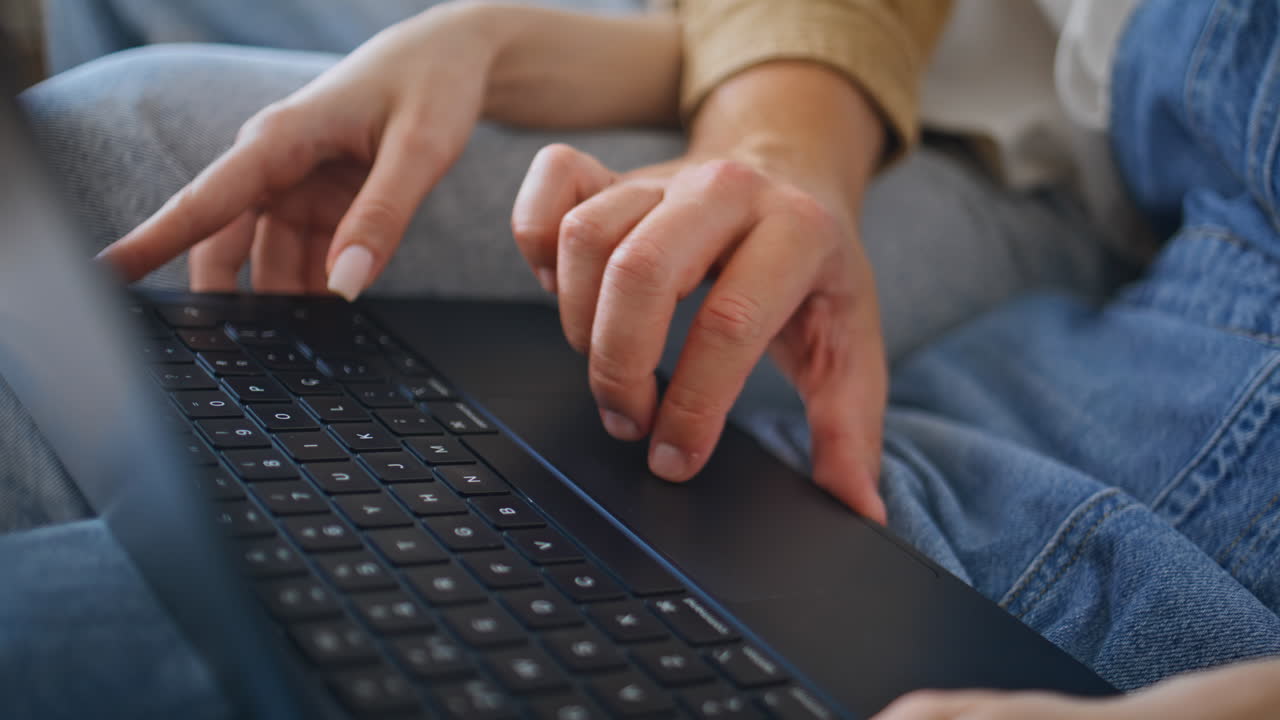 Pair hands browsing laptop in apartment closeup. Man fingers touching touchpad