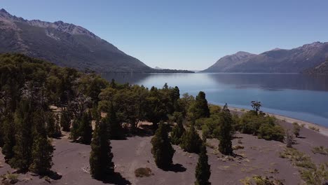 stunning aerial of the lake and water banks in the mountains of patagonia, argentina, south america