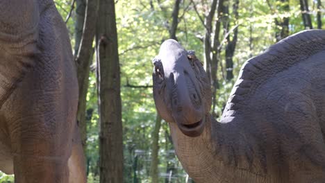dinosaur model in a forest setting