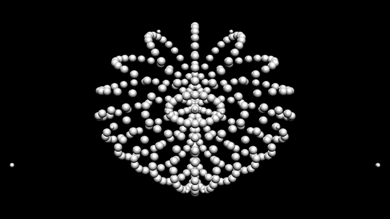 검은색 바탕에 둘러싸여 있는 색 입자의 애니메이션, 추상적인 색 불꽃놀이의 움직임, 비디오 애니메이션