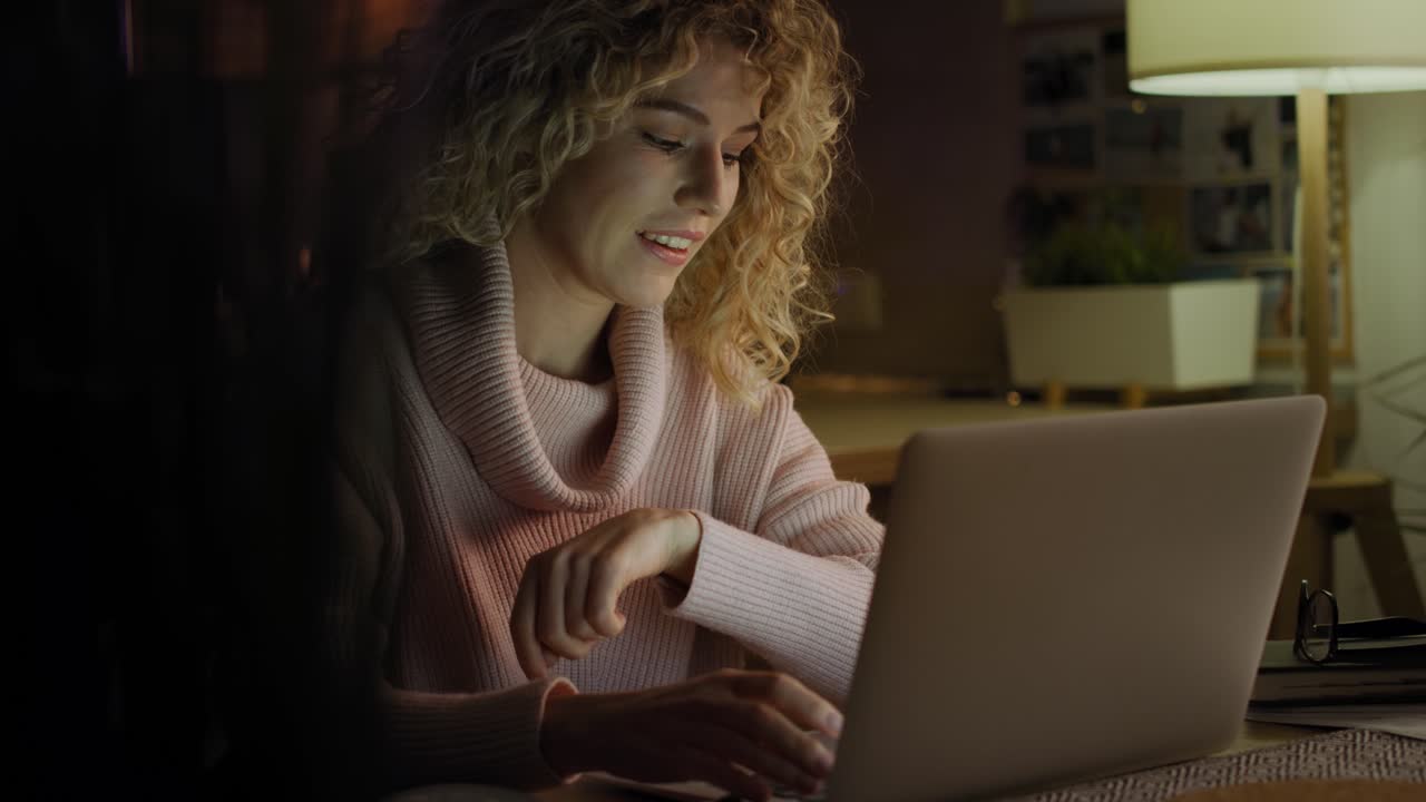 Video of woman conducting video conference to late at home