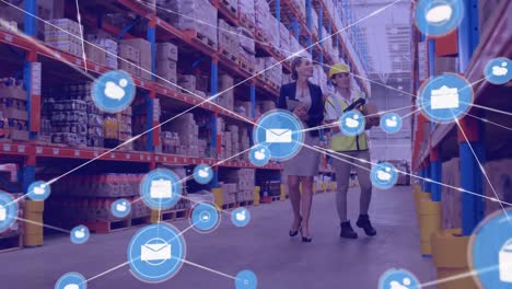 Network-of-digital-icons-against-caucasian-female-supervisor-and-worker-checking-stock-at-warehouse