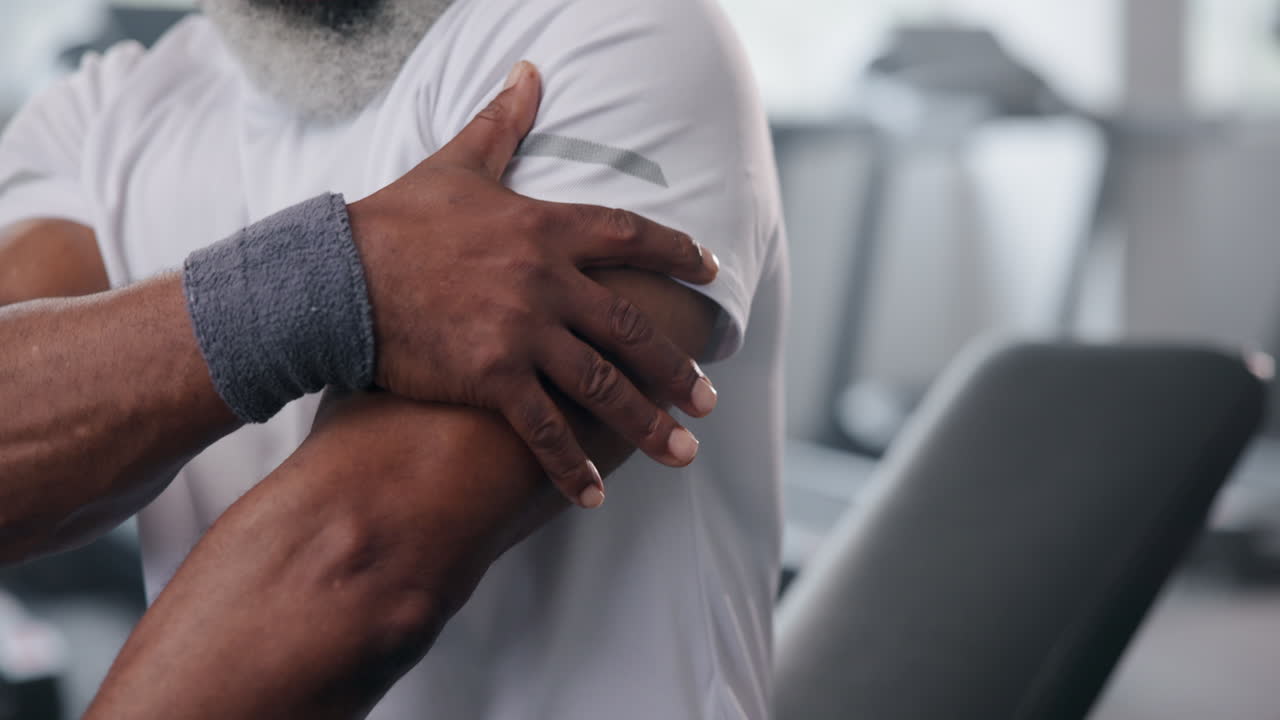 Man with arm pain at the gym