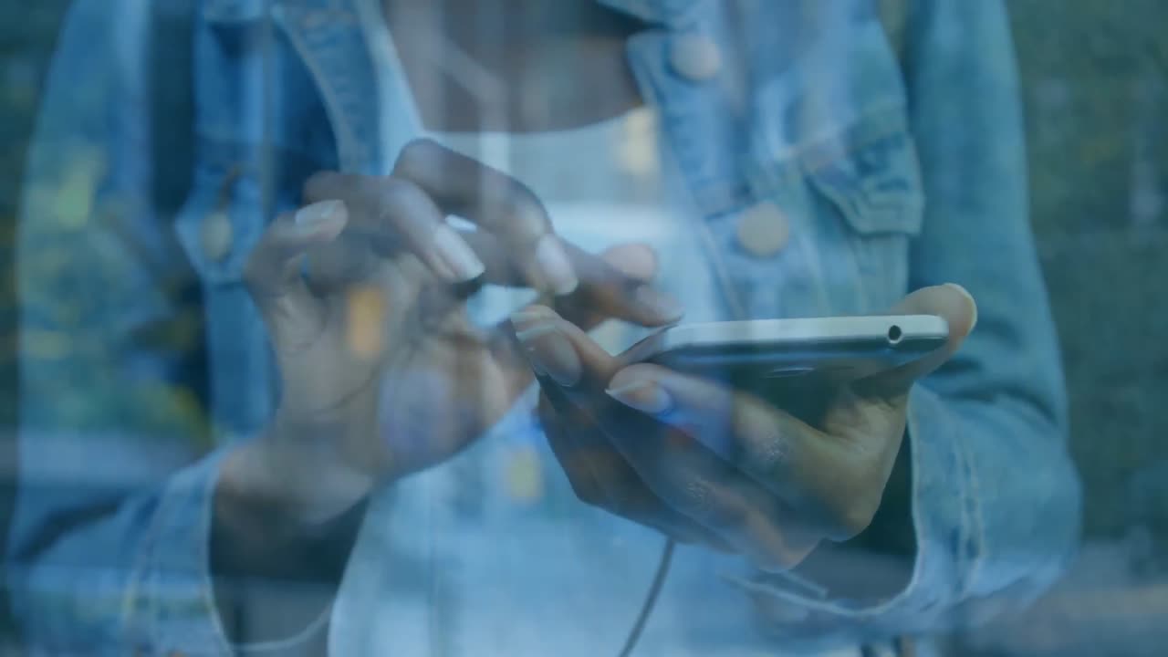 Animation of man using smartphone over cityscape