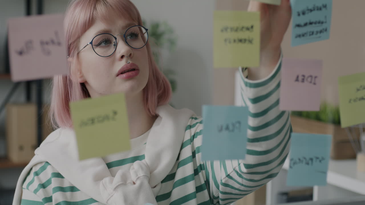 Woman Brainstorming with Post-it Notes