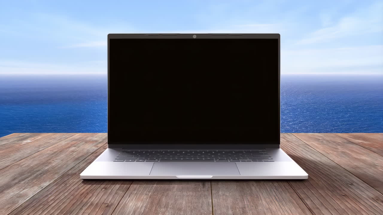 Laptop on a wooden table with ocean background