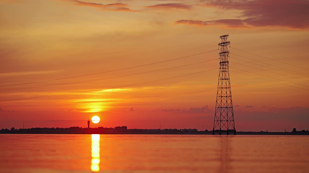 Clean energy lines stretch above sunset lake merging tech with nature