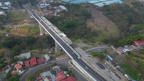 high drone shot of bridge repair over river in san jose costa rica