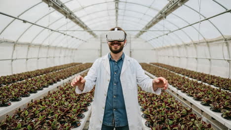 man using vr headset in a greenhouse for agricultural research