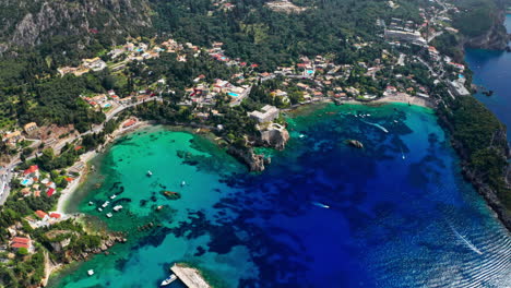 Aerial-drone-shot-over-the-picturesque-rocky-coastline-of-Paleokastritsa-bay-in-Corfu,-Greece