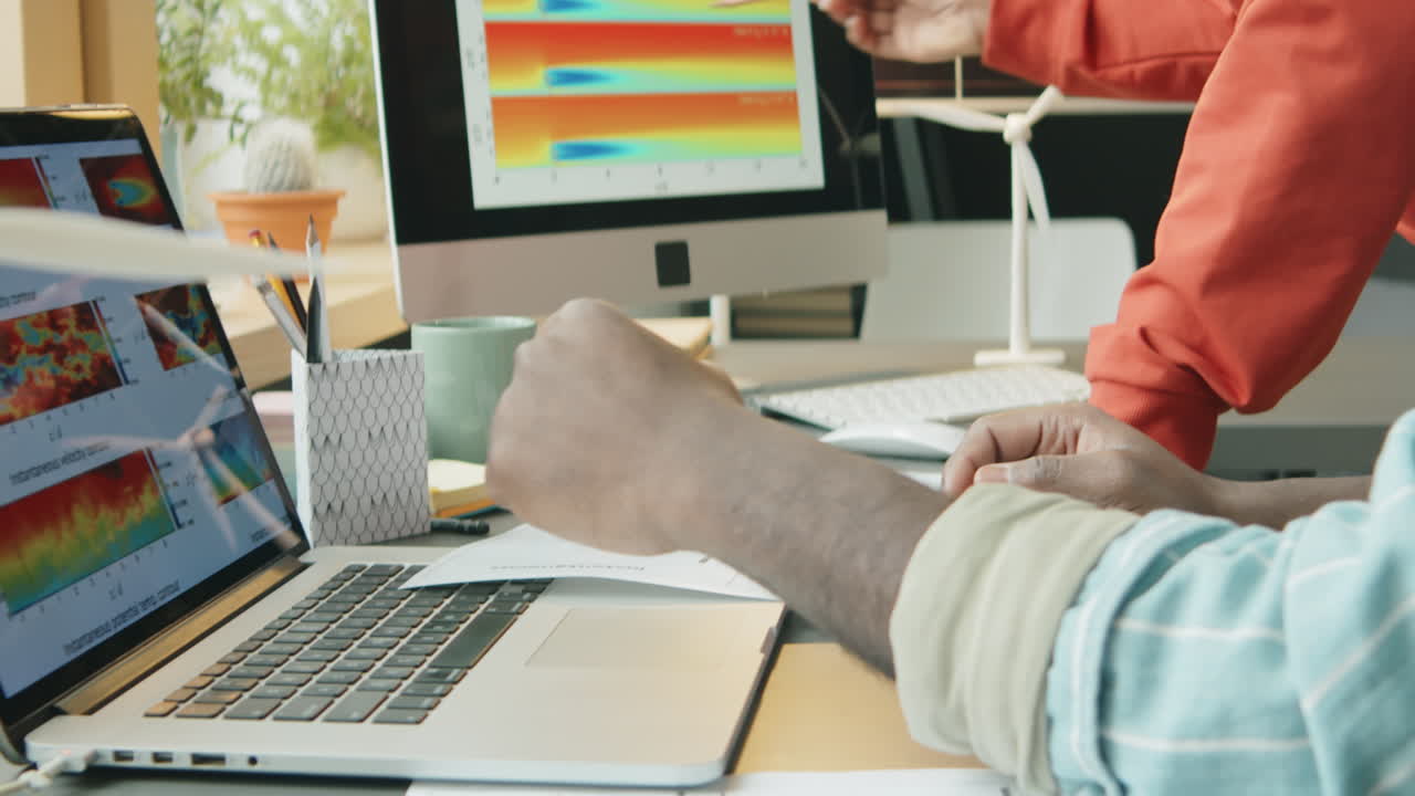 Colleagues Discussing Sustainable Energy Project