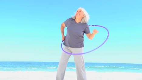 elderly woman doing a hula hoop